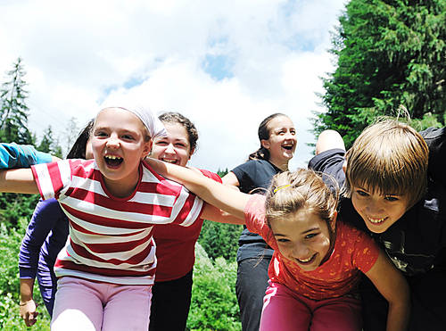 happy children group  have fun outdoor in nature at suny day