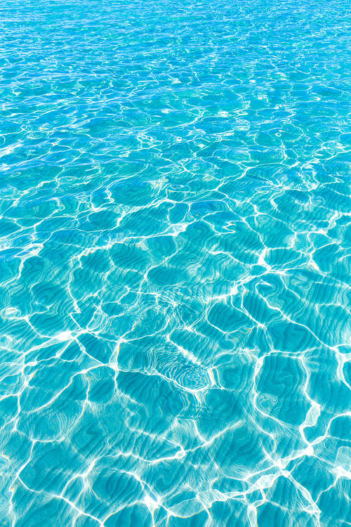 Tropical sea water texture reflections like paradise summer vacation