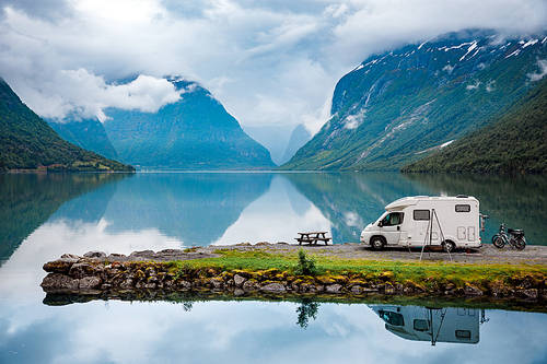 Family vacation travel, holiday trip in motorhome, Caravan car Vacation. Beautiful Nature Italy natural landscape Alps.