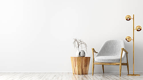 Interior of living room with wooden coffee table, golden floor lamp and gray armchair against white wall with copy space 3d rendering
