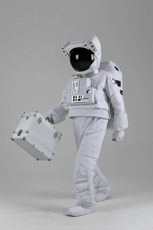 Space Life-An astronaut walking with a hard case