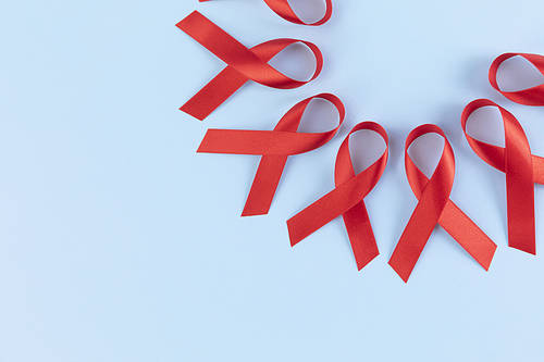 Ribbons - red ribbons placed in a circle on a light blue background