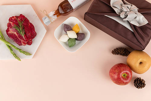 Holiday gift set_Apple and pear fruits, Chuseok related supplies, songpyeon, meat asparagus, and gift wrapped in cloth Top view image photo