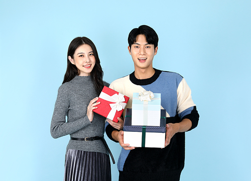 photo of lovers holding gift boxes