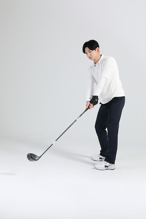 Sports_Picture of a person preparing for a golf swing