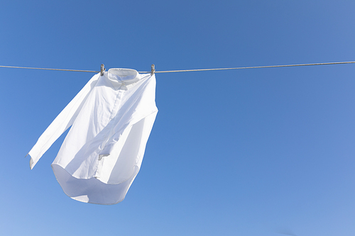 Laundry Laundry_Photo image of a shirt hanging on the clothesline