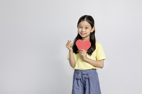 Child_Photo image holding a heart panel