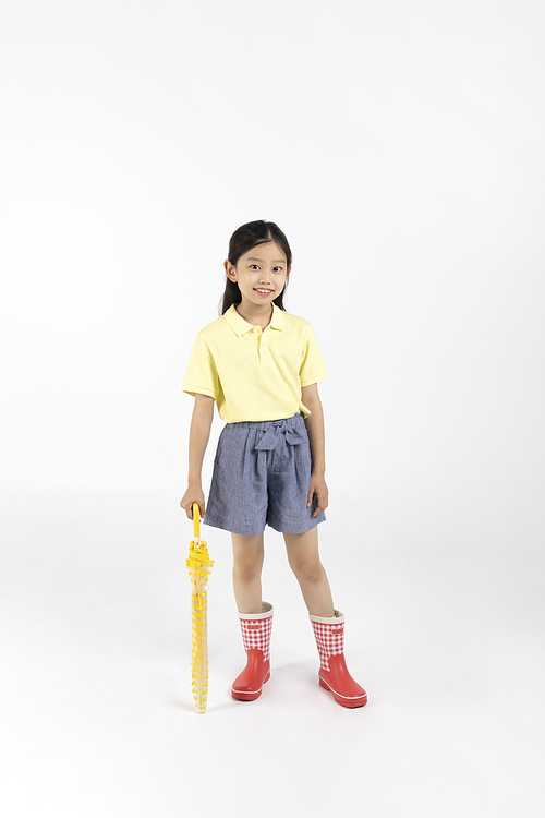 Child_Picture image of wearing boots and holding an umbrella