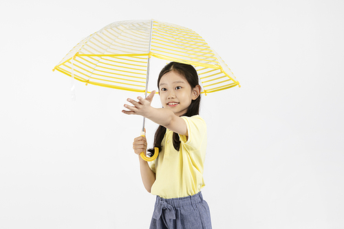 Child_Umbrella and hand outstretched photo image