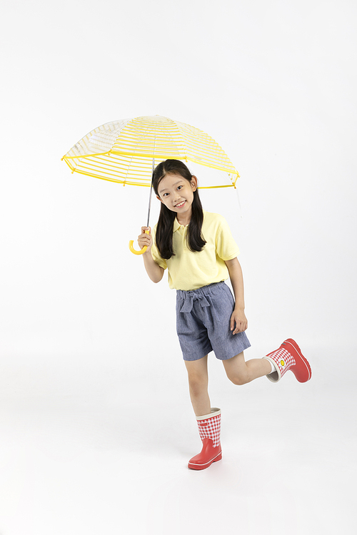 Child_Picture image of wearing boots and holding an umbrella