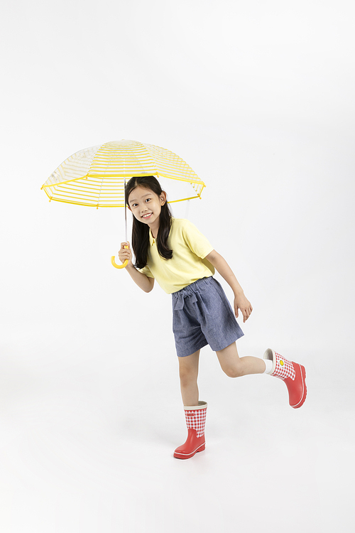 Child_Picture image of wearing boots and holding an umbrella