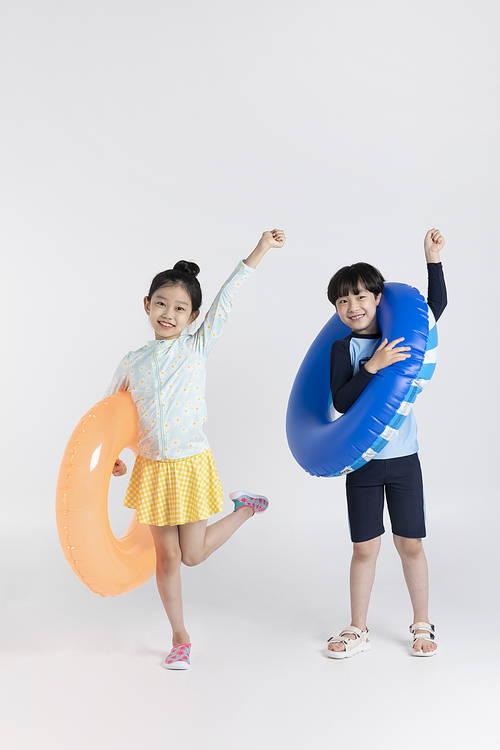 Photo image of child_holding a tube