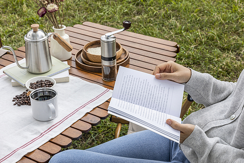 Camping_Image of reading while drinking coffee