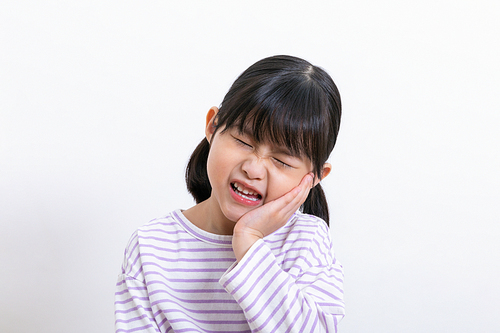 Children's medical_Photo image of a child suffering from toothache