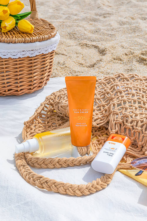 Beach_Photo image of sunscreen placed on the beach