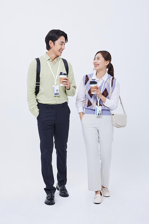 Work-Life Balance_Photo image of a man and a woman smiling and talking while holding coffee cups