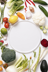Fresh vegetables and fruits arranged in a circle