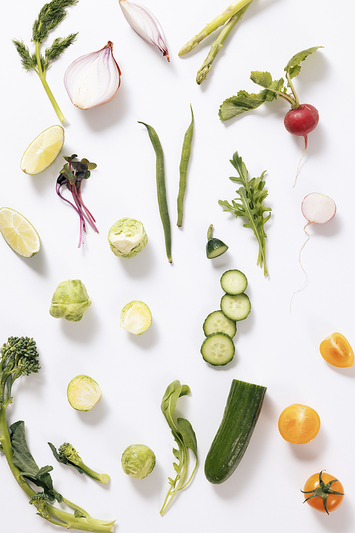 Fresh salad vegetable ingredients on white background