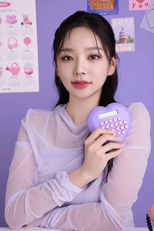 A woman in her 20s holding various poses while holding kitschy items.