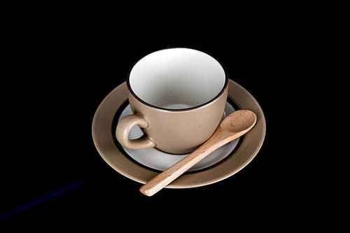 teacup and wooden spoon