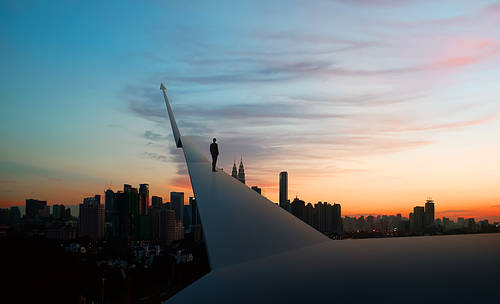 Businessman stand on mockup rising financial chart with sunrise city skyline background . Financial economic growth concept.